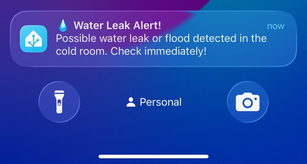 iPhone notification from Home Assistant showing water leak alert with All Clear action button